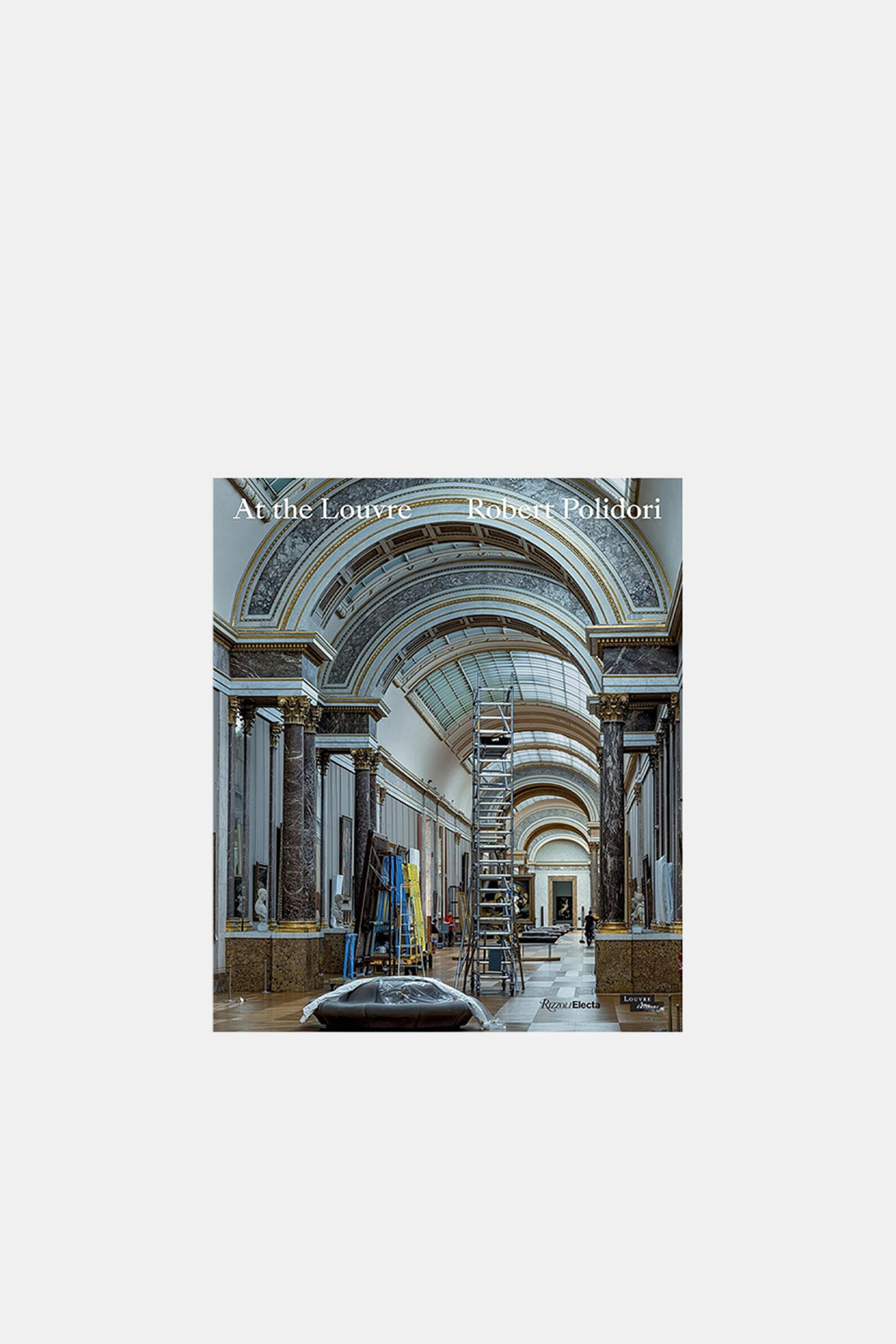 Книга «At The Louvre»